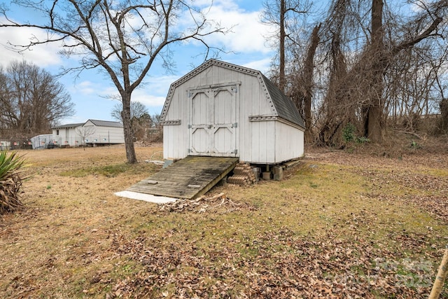 view of outdoor structure with a yard