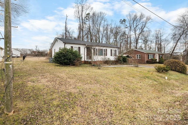 ranch-style house with a front lawn