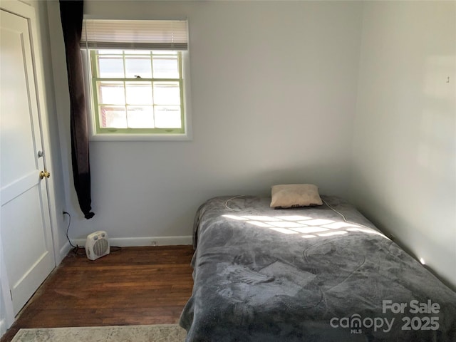 bedroom featuring dark hardwood / wood-style floors