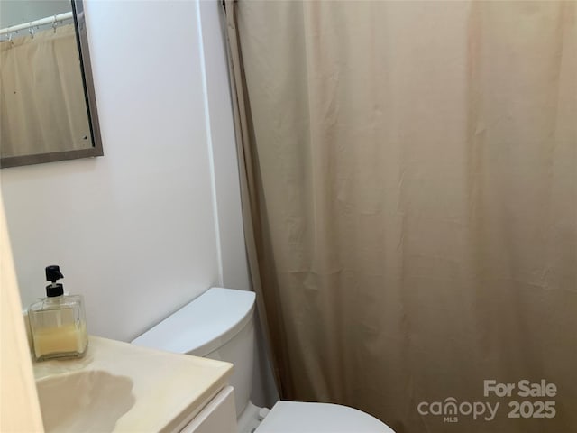 bathroom with vanity and toilet