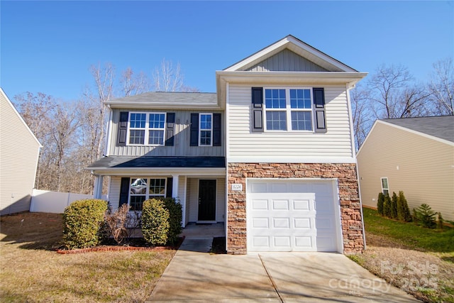 view of front of property with a garage and a front yard