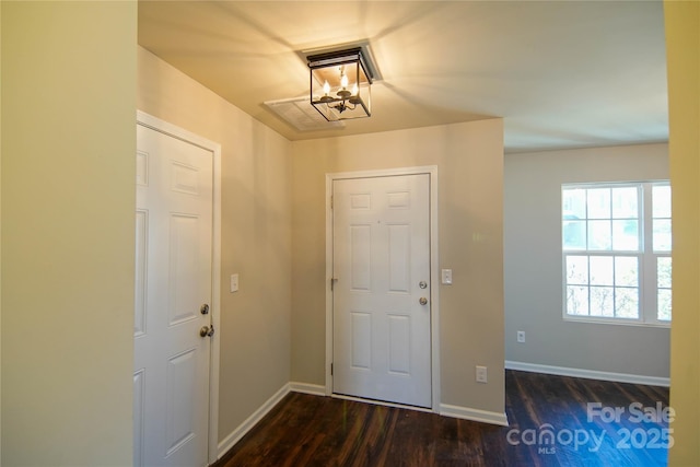 foyer entrance featuring dark hardwood / wood-style floors