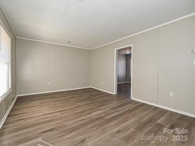 empty room with crown molding and dark wood-type flooring