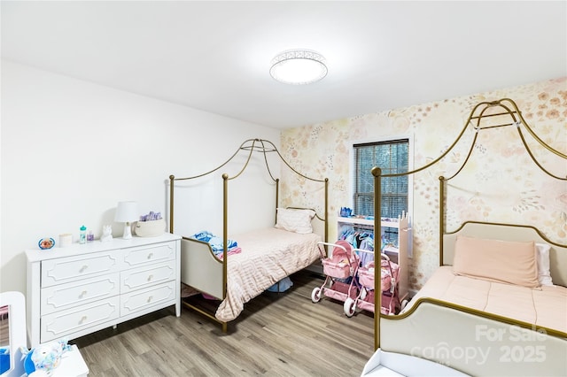 bedroom featuring hardwood / wood-style flooring