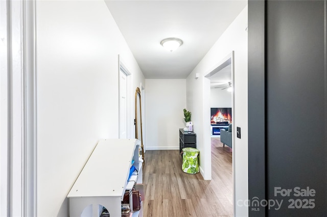 corridor featuring hardwood / wood-style flooring