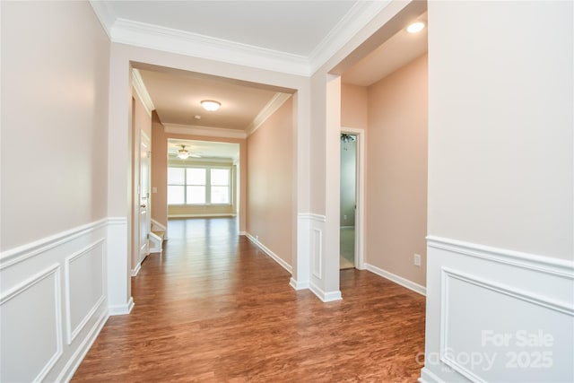 hall with hardwood / wood-style floors and crown molding