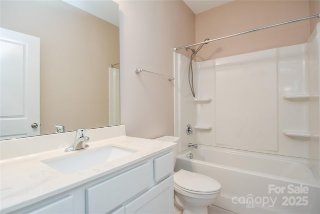 full bathroom featuring shower / bathtub combination, vanity, and toilet