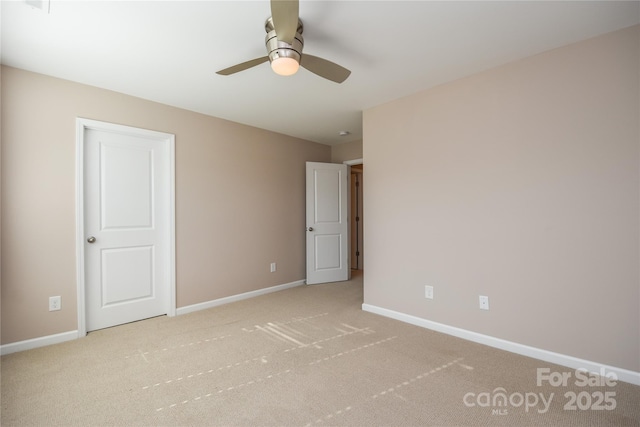 unfurnished bedroom featuring light carpet and ceiling fan