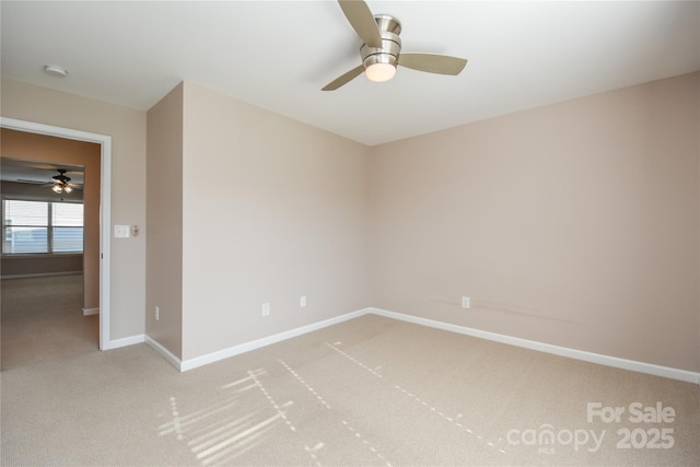 empty room featuring light carpet and ceiling fan