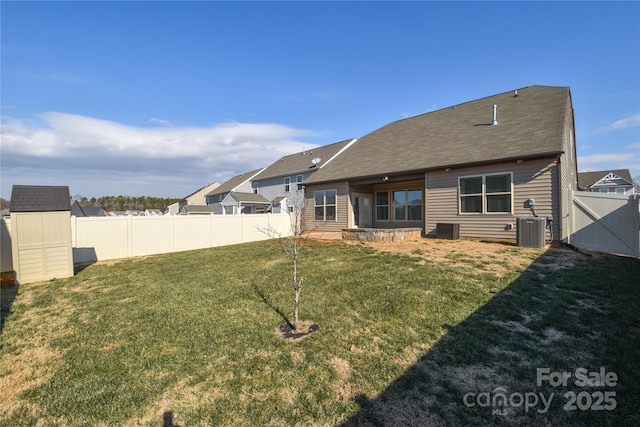 back of house with a patio, a yard, and cooling unit