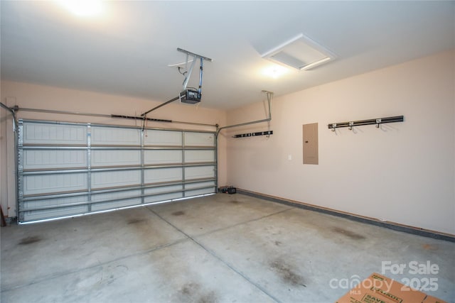 garage with a garage door opener and electric panel