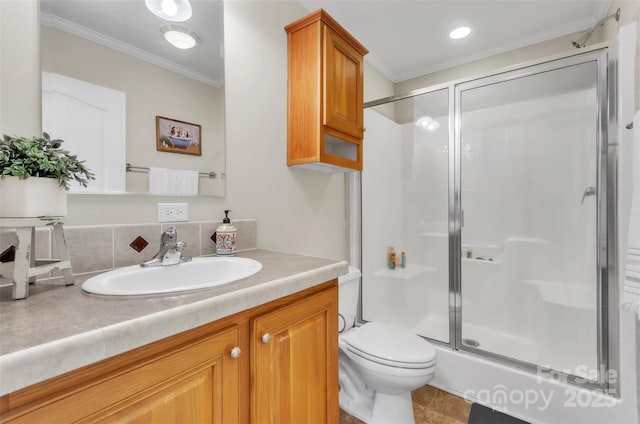 bathroom featuring crown molding, vanity, toilet, and walk in shower