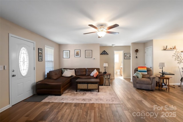 living room featuring hardwood / wood-style flooring and ceiling fan