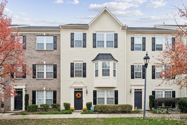 multi unit property featuring brick siding