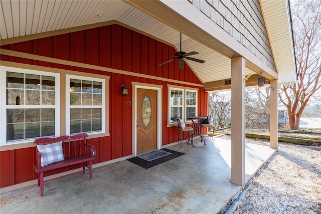 doorway to property featuring covered porch and ceiling fan