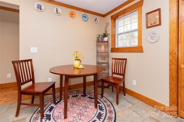 living area with ornamental molding