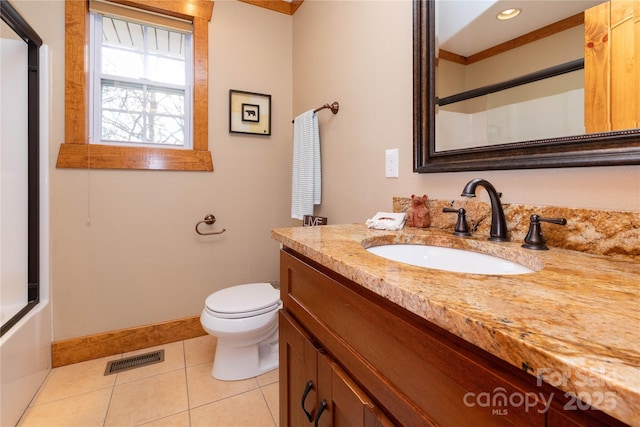 full bathroom featuring vanity, tile patterned floors, enclosed tub / shower combo, and toilet