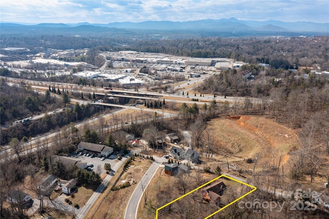 drone / aerial view featuring a mountain view