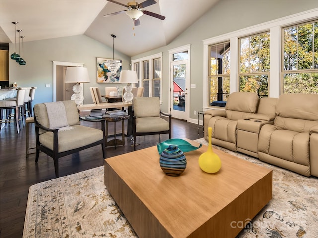 living room featuring vaulted ceiling, dark wood-type flooring, and ceiling fan