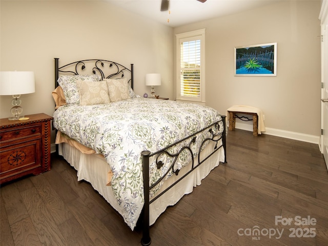 bedroom featuring dark hardwood / wood-style flooring and ceiling fan