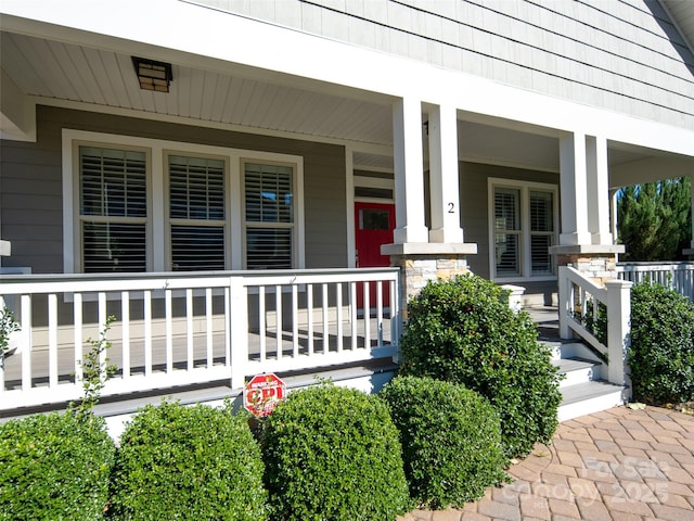 doorway to property featuring covered porch