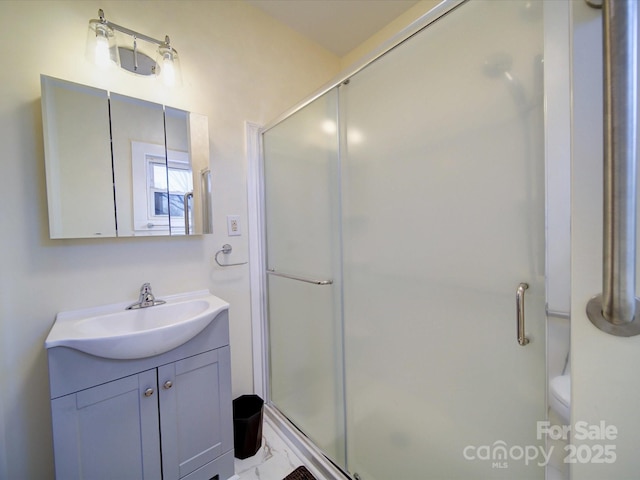 bathroom featuring vanity and walk in shower