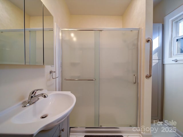 bathroom featuring vanity and walk in shower