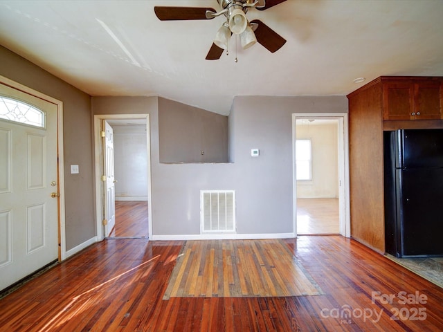 entrance foyer with dark hardwood / wood-style flooring