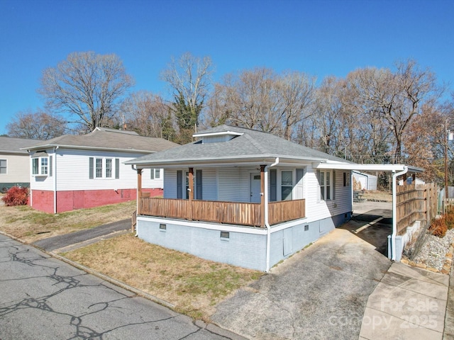 view of front of house featuring a carport and covered porch