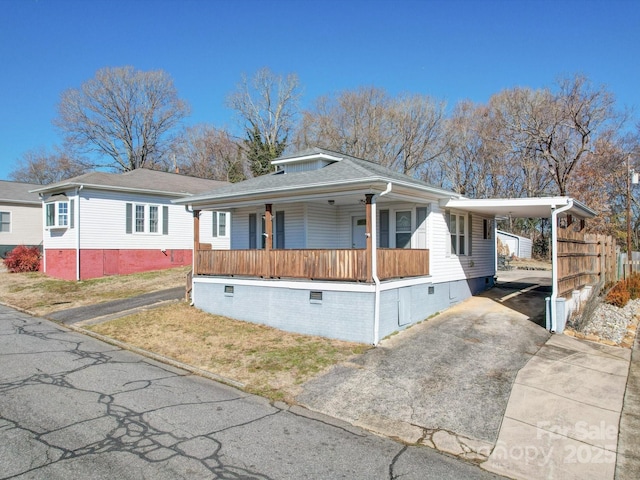 view of front of home featuring a carport and a porch