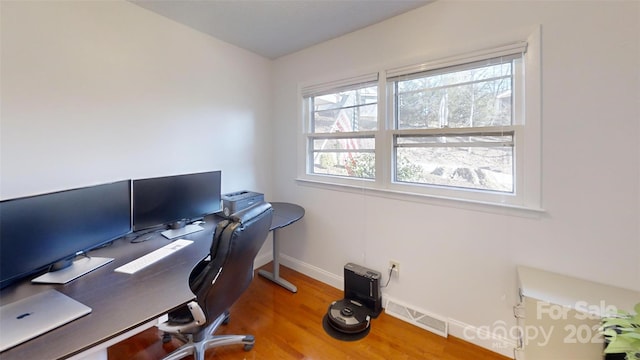 home office featuring hardwood / wood-style floors