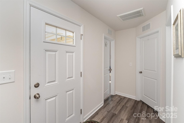 hallway with dark hardwood / wood-style floors