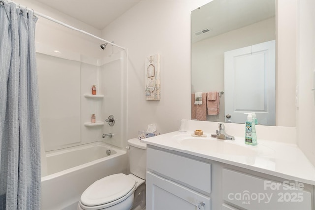 full bathroom with vanity, shower / tub combo, and toilet