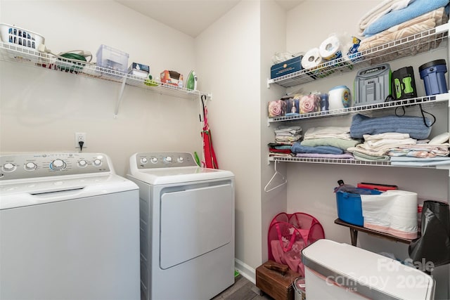 washroom with separate washer and dryer and hardwood / wood-style floors