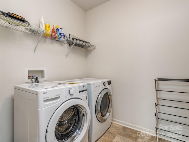 laundry area with separate washer and dryer