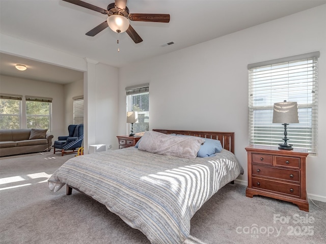 carpeted bedroom featuring ceiling fan