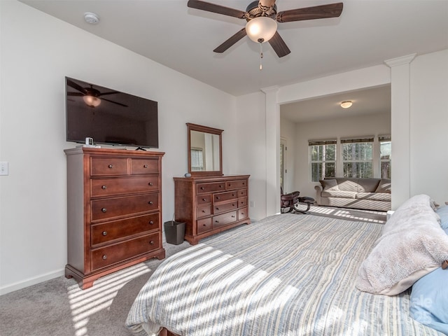 bedroom with ceiling fan and light colored carpet