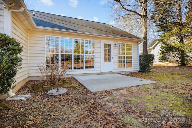 back of house with a patio