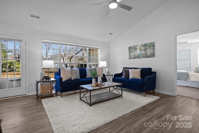 living room featuring ceiling fan, high vaulted ceiling, and dark hardwood / wood-style flooring