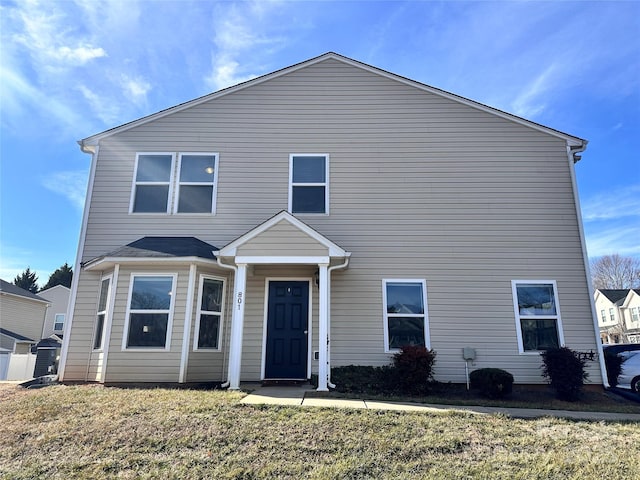 front facade with a front yard