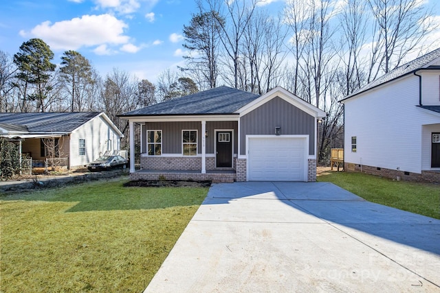 view of front facade with a porch, a garage, and a front yard