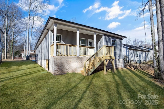 exterior space featuring a front yard and covered porch