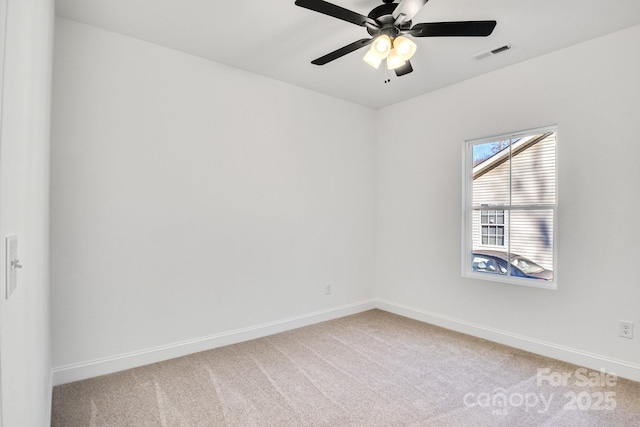 empty room featuring carpet and ceiling fan