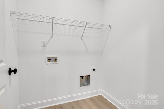 laundry area featuring hardwood / wood-style flooring, washer hookup, and electric dryer hookup