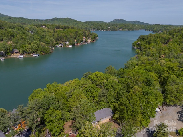 aerial view featuring a water and mountain view