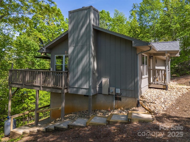 view of side of property featuring a deck