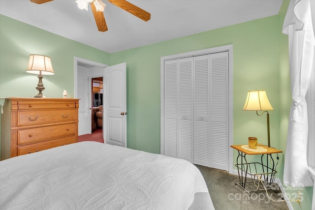 carpeted bedroom with ceiling fan and a closet