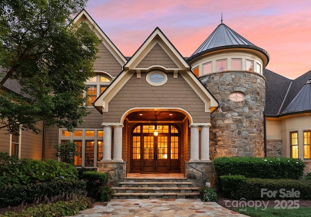 exterior entry at dusk with french doors