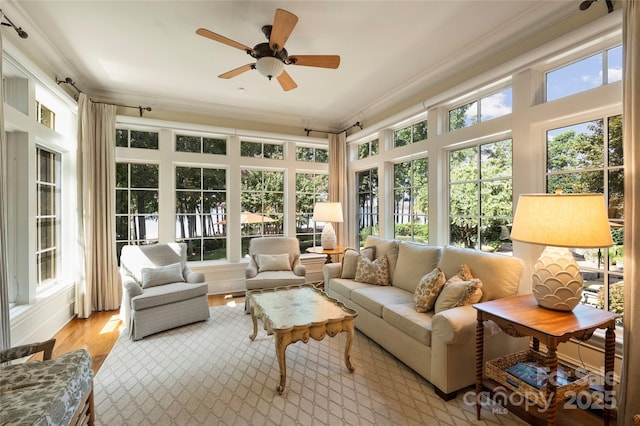 sunroom with a wealth of natural light and ceiling fan