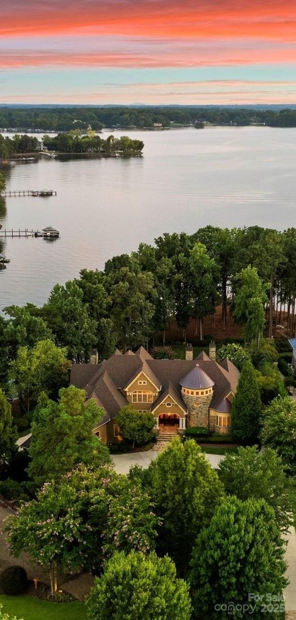 aerial view at dusk with a water view